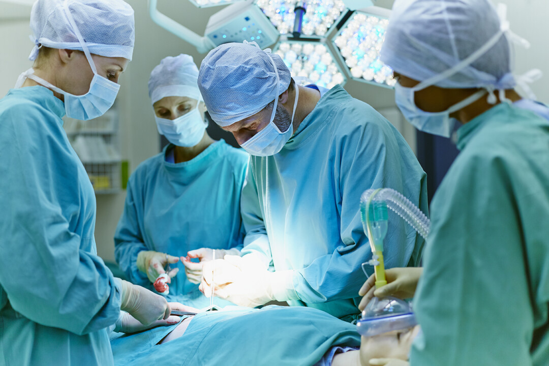 Surgeons performing operation in hospital